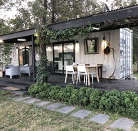 Absolute riverfront shipping container cabin - New South Wales Tourism 